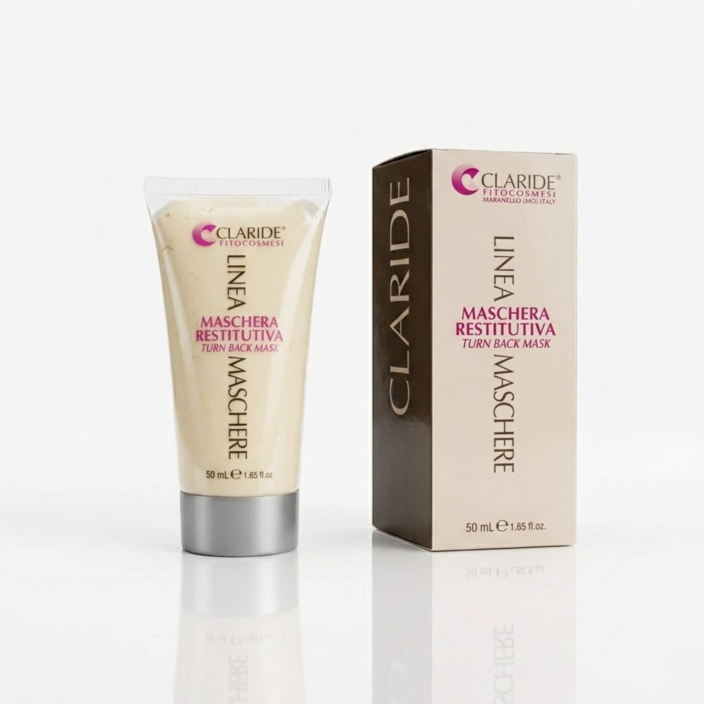 Tubo trasparente con tappo argento che mostra la ricca texture cremosa e scatola della Maschera Restitutiva Claride Fitocosmesi. Trattamento viso intensivo (Turn Back Mask) ad azione anti-age, nutriente e rigenerante, su fondo bianco con riflesso.
