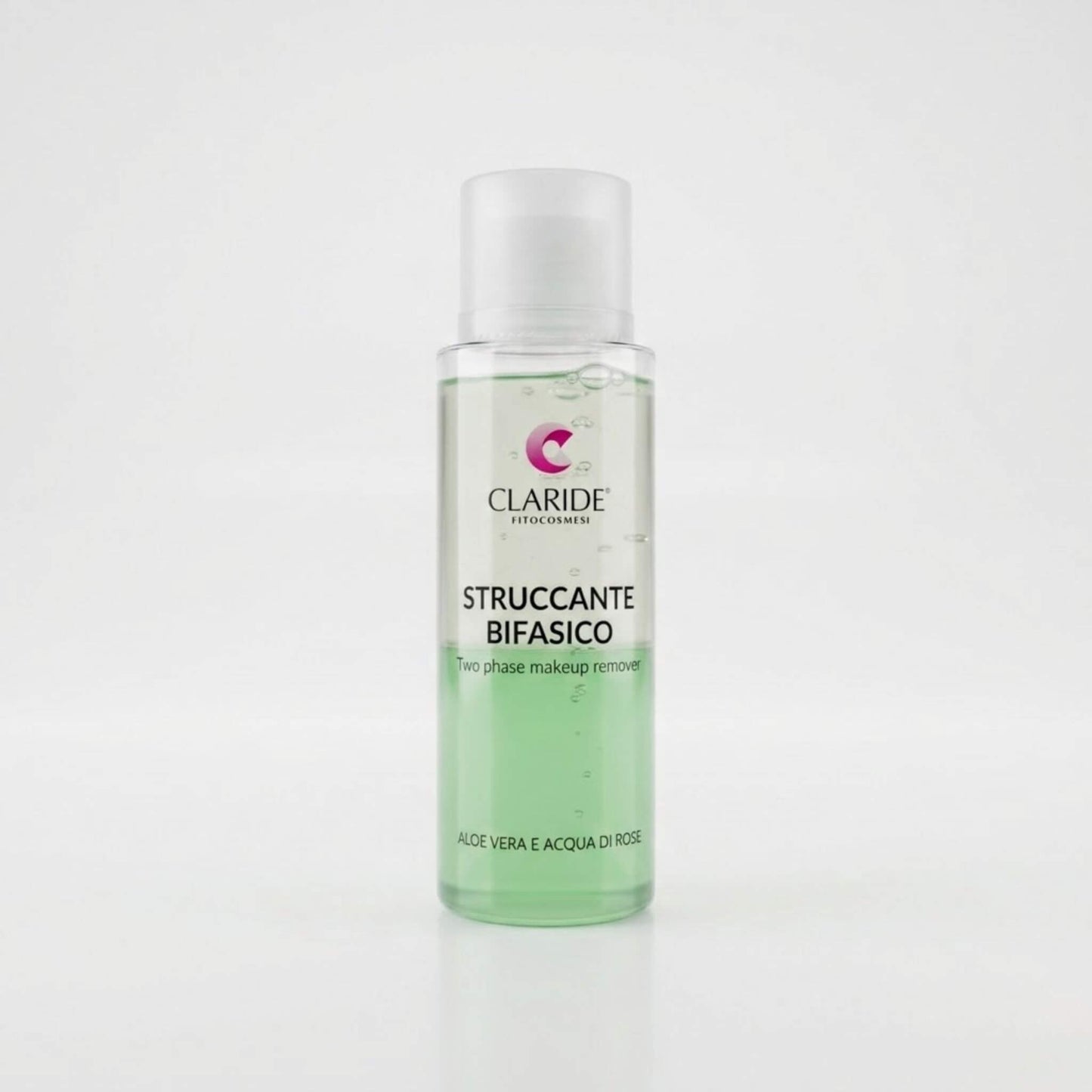 Flacone cilindrico trasparente dello Struccante Bifasico Claride Fitocosmesi che mostra le due fasi liquide separate: verde in basso e trasparente in alto. Detergente (Two Phase Makeup Remover) con Aloe Vera e Acqua di Rose per rimuovere dolcemente il trucco waterproof, su fondo bianco con riflesso.
