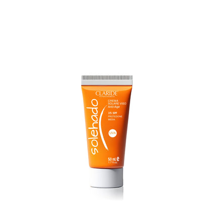 Tubo arancione della crema solare viso anti-age Solehado di Claride con protezione media SPF 25.