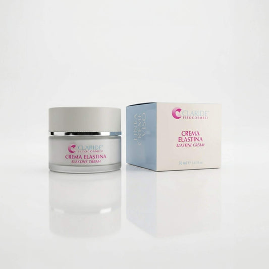 Vasetto in vetro satinato e scatola azzurro polvere della Crema Elastina Claride Fitocosmesi. Trattamento viso anti-age elasticizzante (Elastine Cream) per contrastare i segni del tempo, le rughe d'espressione e la perdita di tono, su fondo bianco con riflesso.