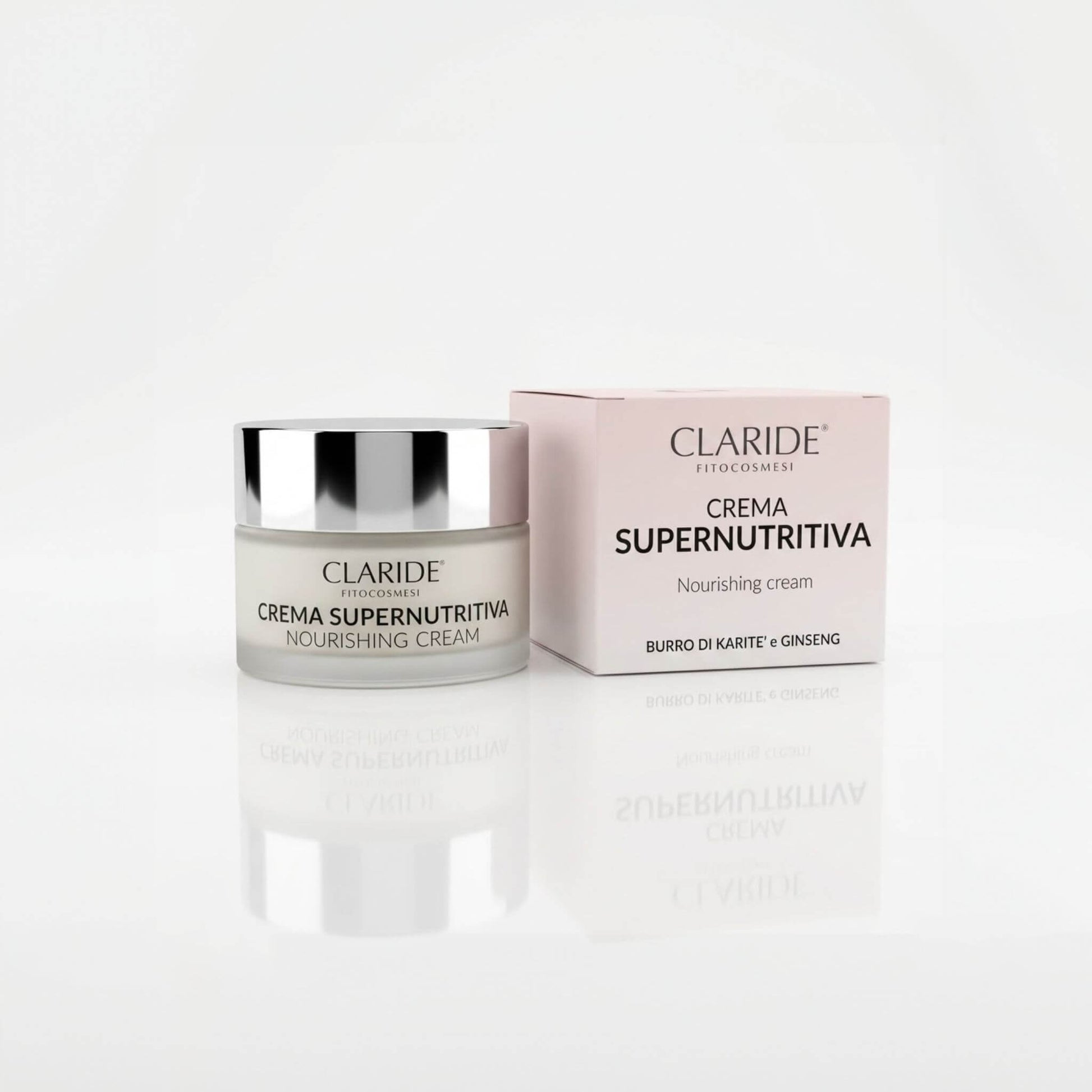 Vasetto in vetro satinato e scatola rosa della Crema Supernutritiva Claride Fitocosmesi. Trattamento viso nutriente (Nourishing Cream) con Burro di Karité e Ginseng per pelli secche e spente, su fondo bianco con riflesso.