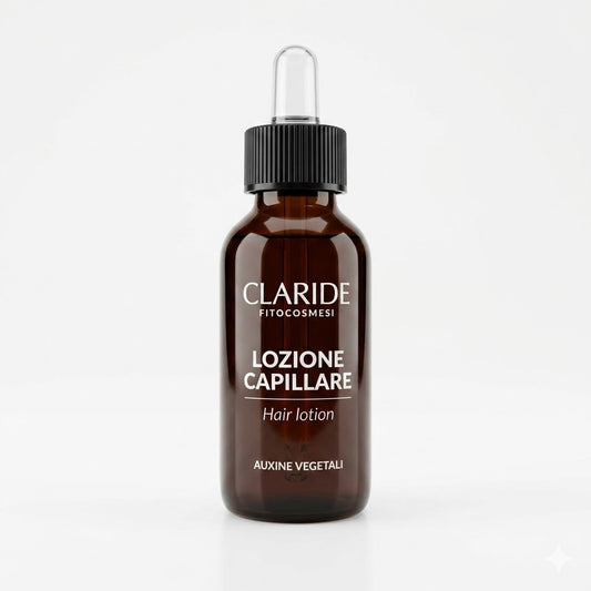 Flacone in vetro ambrato con contagocce della Lozione Capillare Claride Fitocosmesi. Trattamento urto a base di Auxine Vegetali per stimolare il cuoio capelluto, rinforzare le radici e contrastare l'indebolimento dei capelli, su fondo bianco.