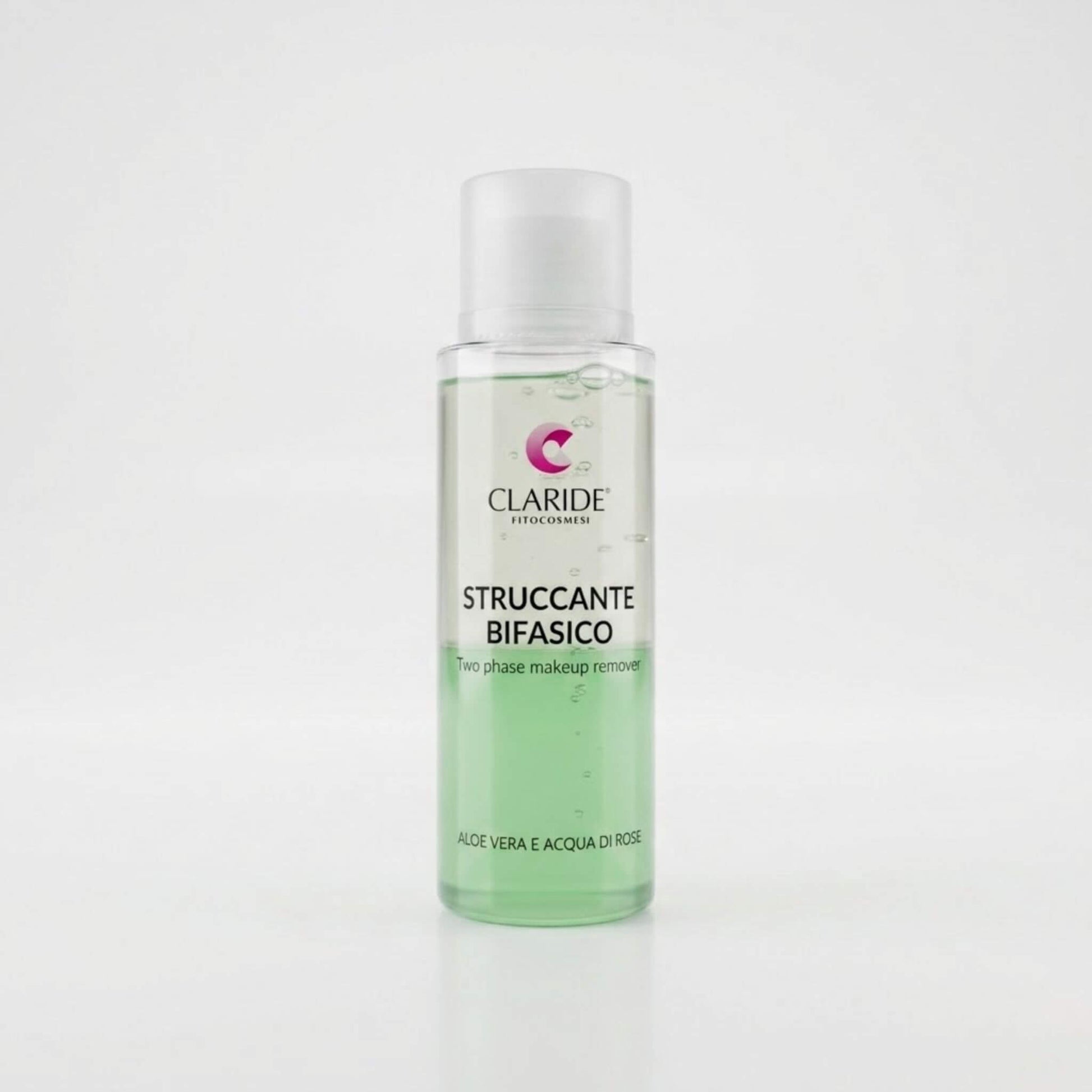 Flacone cilindrico trasparente dello Struccante Bifasico Claride Fitocosmesi che mostra le due fasi liquide separate: verde in basso e trasparente in alto. Detergente (Two Phase Makeup Remover) con Aloe Vera e Acqua di Rose per rimuovere dolcemente il trucco waterproof, su fondo bianco con riflesso.